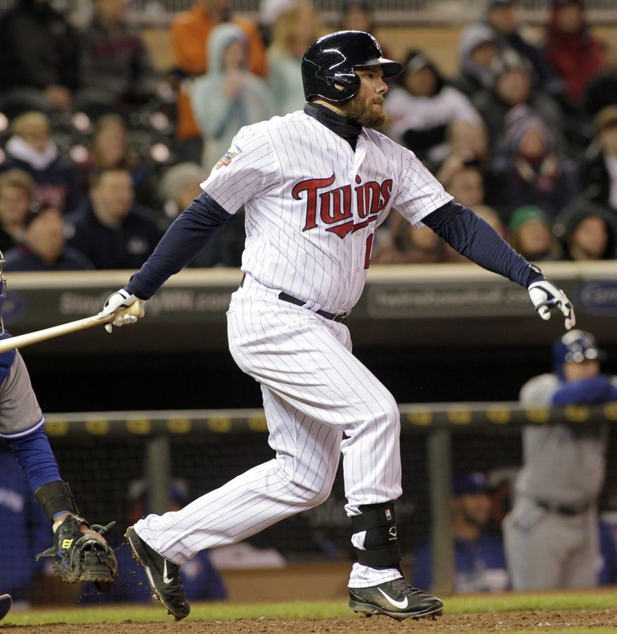 Minnesota Twins' Jason Kubel watches his two-run single during the eighth inning of the second game of a baseball doubleheader against the Toronto Blue Jays, Thursday, April 17, 2014, in Minneapolis. Minnesota won 9-5. AP Photo/Paul Battaglia)
