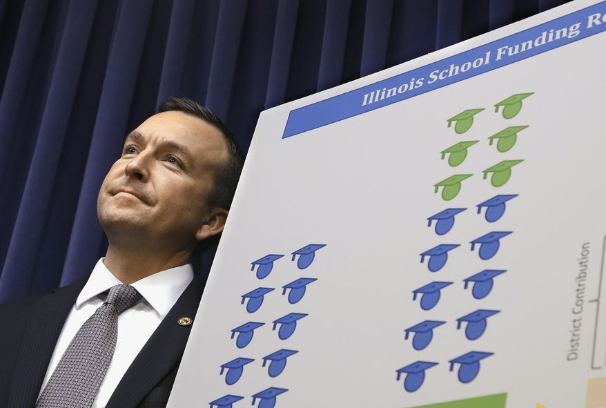 FILE - In this April 2, 2014 file photo, Illinois Sen. Andy Manar, D - Bunker Hill, introduces an education funding reform bill at the State Capitol in Springfield, Ill. Most of Illinois’ 860 school districts would see severe cuts in funding if the state’s temporary tax increase is rolled back as scheduled, according to a document circulated this week as part of Illinois Democrats’ campaign to preserve the tax hike and push to update the state’s school funding formula. The document cites what would be a total of $450 million in general state aid cuts to schools. (AP Photo/Seth Perlman, File)