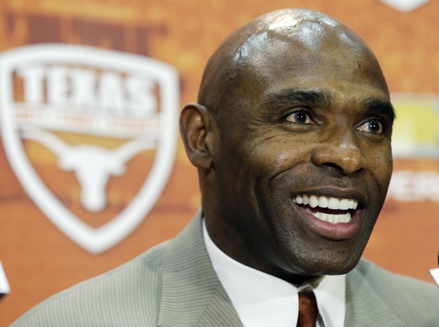 FILE - In this Jan. 6, 2014 file photo, Charlie Strong answers questions during a news conference where he was introduced as the new Texas football coach in Austin, Texas. For the first time since 1997, the Texas Longhorns will suit up for a game without Mack Brown on the sideline. (AP Photo/Eric Gay)