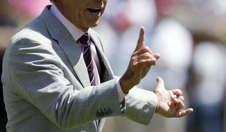Alabama coach Nick Saban signals a fourth and 1 during Alabama&#39;s A-Day NCAA college football spring game Saturday, April 19, 2014, in Tuscaloosa, Ala. (AP Photo/Butch Dill)