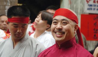 FILE - In this Aug. 6, 2006 file photo, Raymond &amp;quot;Shrimp Boy&amp;quot; Chow smiles after being sworn in as the &amp;quot;Dragon Head&amp;quot; of the Chee Kung Tong in Chinatown in San Francisco. Chow, a central figure in a sweeping San Francisco organized crime and public corruption case, pleaded not guilty. The FBI spent many millions of dollars and used more than a dozen undercover operatives posing as honest businessmen and Mafia figures alike during its seven year organized crime investigation centered in San Francisco’s Chinatown. Now, an increasing number of the defendants caught up in the probe that has ensnared a state senator and an aide are arguing that the FBI and its undercover agents are guilty of entrapment, luring otherwise honest people to go along with criminal schemes hatched by federal officials. (AP Photo/Sing Tao Daily, File)