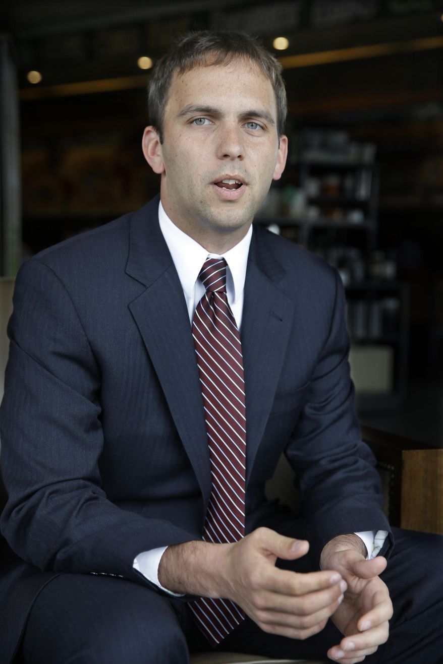 In this April 18, 2014 photo, Frank Broomell Jr. answers a question in Sicklersville, N.J. Broomell, a 27-year-old former Marine who is now working on his master’s degree at Harvard, is a Congressional candidate for New Jersey’s 1st District seat held since 1990 by Rob Andrews, who announced on Feb. 4, that he was resigning. In the June 3, Democratic primary, Broomell will face Logan Township Mayor Frank Minor and state Sen. Donald Norcross. (AP Photo/Mel Evans)