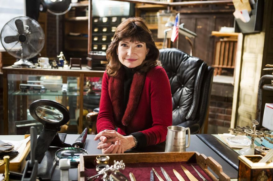This photo provided by Hallmark Channel shows creator Martha Williamson on the set of the TV series, "Signed, Sealed, Delivered." The writer-producer Williamson, who produced “Touched by an Angel,” returns to TV with the new Hallmark Channel show, debuting April 20, 2014. (AP Photo/Hallmark Channel, Katie Yu) **MANDATORY CREDIT**