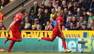 Liverpool&#39;s Raheem Sterling, right, celebrates scoring the opening goal during their English Premier League match against Norwich City at Carrow Road, Norwich, eastern England, Sunday April 20, 2014. (AP Photo/PA, Chris Radburn)  UNITED KINGDOM OUT  NO SALES  NO ARCHIVE