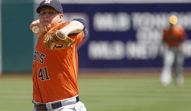Houston Astros pitcher Brad Peacock delivers a pitch during a baseball game against the Oakland Athletics in Oakland, Calif. on Sunday, April 20, 2014. (AP Photo/Matthew Sumner)