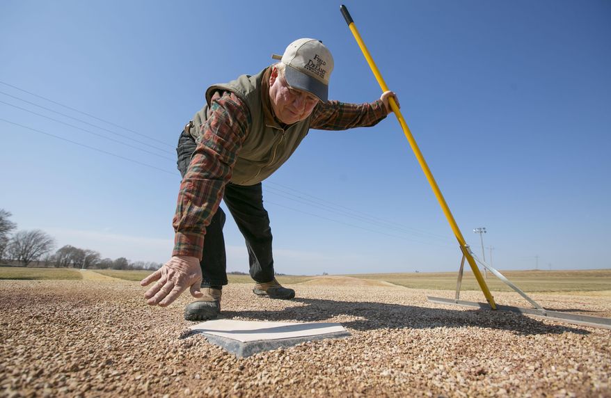 In this March 31, 2014 photo, Don Lansing, former owner of the house and farm where the Field of Dreams film site is located, still prepares the diamond and mows the grass for visitors near Dyersville, Iowa. "Field of Dreams," which premiered in Iowa 25 years ago has become one of the most beloved movies in a generation and transformed this small patch of Dubuque County into Iowa's most famous farm. (AP Photo/The Des Moines Register, Rodney White)