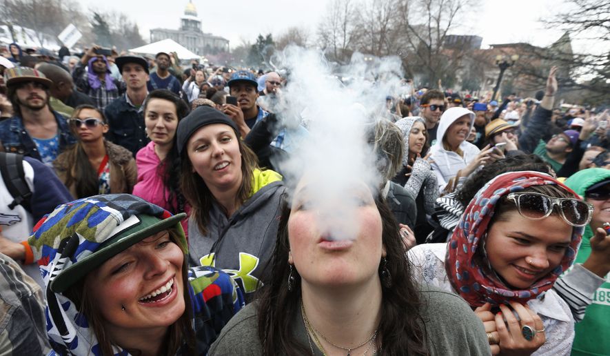 Smokin&#x27;: Cannabis lovers revel in the freedom to smoke marijuana during the 4/20 festival this weekend in Denver. It was the first time the annual celebration was held since Colorado legalized pot for recreational use. On Monday, however, state lawmakers moved to tighten rules on marijuana products in the wake of two tragic deaths thought to be related to the drug. Story, A5. (Associated Press photographs)