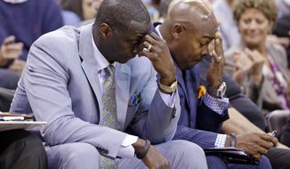 FILE - In this April 14, 2014, file photo, Utah Jazz&#x27;s head coach Tyrone Corbin, left, lowers his head late in the fourth quarter during an NBA basketball game against the Los Angeles Lakers, in Salt Lake City, Utah. The Jazz announced Monday, April 21, 2014, that the team won&#x27;t be offering Corbin a new contract. (AP Photo/Rick Bowmer, File)