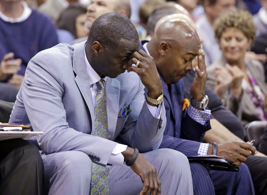 FILE - In this April 14, 2014, file photo, Utah Jazz's head coach Tyrone Corbin, left, lowers his head late in the fourth quarter during an NBA basketball game against the Los Angeles Lakers, in Salt Lake City, Utah. The Jazz announced Monday, April 21, 2014, that the team won't be offering Corbin a new contract. (AP Photo/Rick Bowmer, File)