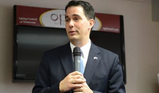 Wisconsin Gov. Scott Walker speaks during an event to announce the expansion of Family Care, a state-administered program that provides long-term care to disabled and elderly residents under Medicaid during an event at Options for Independent Living in Green Bay Monday, April 21, 2014.  (AP Photo/Press-Gazette Media, Jim Matthews)