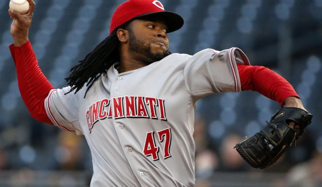Cincinnati Reds starting pitcher Johnny Cueto delivers during the first inning of a baseball game against the Pittsburgh Pirates in Pittsburgh Tuesday, April 22, 2014. (AP Photo/Gene J. Puskar)