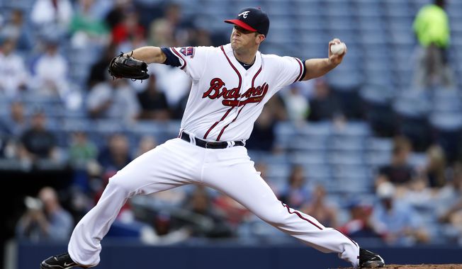 Atlanta Braves pitcher Alex Wood (40) works in the first inning of a baseball game against the Miami Marlins Tuesday, April 22, 2014 in Atlanta.  (AP Photo/John Bazemore)