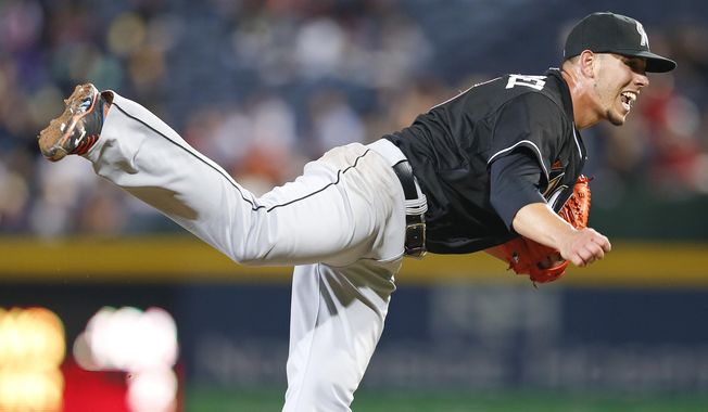 Miami Marlins starting pitcher Jose Fernandez (16) works in the sixth inning of a baseball game against Atlanta Braves Tuesday, April 22, 2014 in Atlanta.  (AP Photo/John Bazemore)