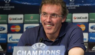 FILE - This is a Wednesday, April 2, 2014 file photo of Paris Saint Germain&#39;s coach Laurent Blanc, as he smiles during press conference prior to a training session at Parc des Princes stadium in Paris .  Blanc is one of the  potential full-time replacements for David Moyes as Manchester United manager after his firing on Tuesday, April 22, 2014. (AP Photo/Michel Euler, File)