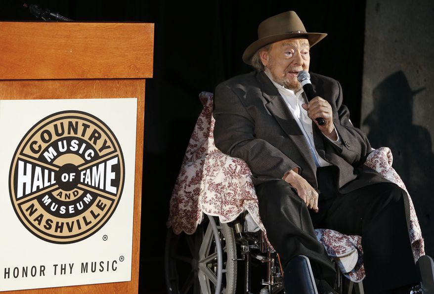 Mac Wiseman speaks after he was introduced as one of three new inductees into the Country Music Hall of Fame Tuesday, April 22, 2014, in Nashville, Tenn. Wiseman was elected along with Ronnie Milsap and the late Hank Cochran. (AP Photo/Mark Humphrey)