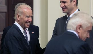 U.S. Vice President Joe Biden speaks with Ukrainian members of parliament, including Vitali Klitschko, facing camera right, during a meeting in Kiev, Ukraine, Tuesday, April. 22, 2014.  Vice President Joe Biden told Ukrainian political leaders Tuesday that the United States stands with them against &amp;quot;humiliating threats&amp;quot; and encouraged them to root out corruption as they rebuild their government. In the most high-level visit of a U.S. official since crisis erupted in Ukraine, Biden told leaders from various political parties that he brings a message of support from President Barack Obama as they face a historic opportunity to usher in reforms. (AP Photo/Sergei Chuzavkov)