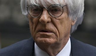 FILE - In this Nov. 11, 2013 file picture President and CEO of Formula One Management Bernie Ecclestone arrives for his case at the High Court in London. Ecclestone goes on trial in Munich on Thursday, April 24, 2014, on bribery charges that could put him in prison for up to 10 years if convicted. The trial could spell the end of the 83-year-old Ecclestone’s career in the racing series that has become a lucrative business under his guidance. (AP Photo/Matt Dunham, File)