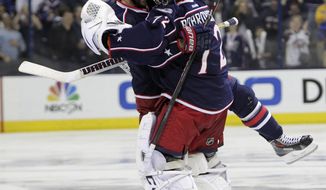 Columbus Blue Jackets&#39; Nick Foligno, left, and Sergei Bobrovsky, of Russia, celebrate Foligno&#39;s game-winning goal against the Pittsburgh Penguins in Game 4 of a first-round NHL playoff hockey series on Wednesday, April 23, 2014, in Columbus, Ohio. The Blue Jackets defeated the Penguins 4-3 in overtime. (AP Photo/Jay LaPrete)