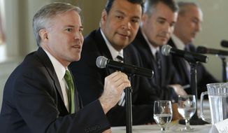 Democrat Derek Cressman, left, a candidate for Secretary of State, makes his opening statement during a candidates debate held by the Sacramento Press Club in Sacramento, Calif.,  Wednesday, April 23, 2014. Cressman debated a fellow Democrat, state Sen. Alex Padilla of Los Angeles, second from left, Republican Pete Peterson, third from left, and Dan Schnur, a USC professor running as an independent, far  right.(AP Photo/Rich Pedroncelli)