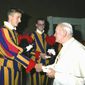 Andreas Widmer shakes the hand of Pope John Paul II before leaving the Swiss Guard. &quot;I know a saint,&quot; Mr. Widmer said with a laugh. &quot;I&#39;m becoming a secondary relic.&quot;