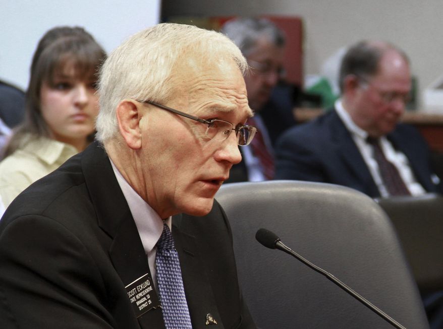 FILE - In this Feb 6, 2014 file photo, South Dakota state Rep. Scott Ecklund, R-Brandon, a sponsor of the bill to provide prenatal care to immigrant women who are not citizens, speaks during a committee hearing Thursday, Feb 6, 2014, in Pierre, S.D. Ecklund says the measure to provide prenatal care to immigrant women will save babies lives and save the state money. He is a family physician in Brandon and deliveries babies. He calls the proposed change a “no-brainer.” (AP Photo/Jill Kokesh, File)