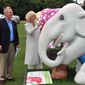 FILE - A  June 24, 2010 photo from files showing Mark Shand, left, brother of The Duchess of Cornwall showing her an elephant sculpture titled Mr. Cameron as she is escorted around the Elephant Parade exhibition at Chelsea Hospital Gardens. Royal officials in Britain say that the brother of Camilla, Duchess of Cornwall, has died after sustaining a serious head injury following a fall in New York. Clarence House said that the 62-year-old Mark Shand died in the hospital Wednesday, April 23, 2014, after falling late Tuesday. (AP Photo/Ian Nicholson, Pool, File)