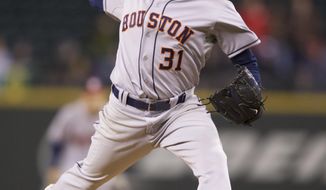 Houston Astros starter Collin McHugh delivers a pitch in the seventh inning of a  baseball game against the Seattle Mariners, Tuesday, April 22, 2014, in Seattle. (AP Photo/Stephen Brashear)