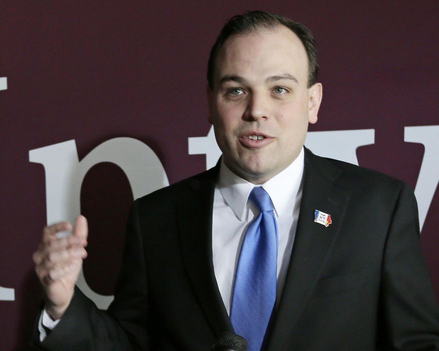 FILE - In this March 26, 2104 file photo Iowa Sec. of State Matt Schultz speaks in Johnston, Iowa. Schultz, who is running for Congress as a budget-cutting conservative, allowed his top aide to keep collecting a $126,000 annual salary for months after deciding to eliminate his job, The Associated Press has learned. (AP Photo/Charlie Neibergall, File)