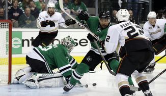 Dallas Stars&#39; Kari Lehtonen (32), of Finland, defends on a shot as defenseman Trevor Daley (6) helps against pressure from Anaheim Ducks center Mathieu Perreault (22) in the second period of Game 4 of a first-round NHL hockey Stanley Cup playoff series, Wednesday, April 23, 2014, in Dallas. (AP Photo/Tony Gutierrez)
