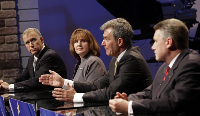 North Carolina Republican senatorial candidate Greg Brannon, second from right, responds during a live televised debate at WRAL television studios as Thom Tillis, left, Heather Grant, and Mark Harris, right, listen in Raleigh, N.C., Wednesday, April 23, 2014. (AP Photo/Gerry Broome, Pool)