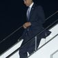 U.S. President Barack Obama steps from Air Force One as he arrives at Haneda International Airport in Tokyo, Wednesday, April 23, 2014. Obama began a four-country trip through the Asia-Pacific region. (AP Photo/Carolyn Kaster)
