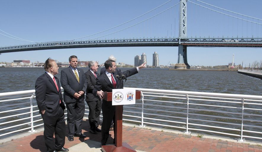 Pennsylvania Auditor General Eugene DePasquale points to the Ben Franklin Bridge during a press conference to announce bi-state legislation to reform the Delaware River Port Authority, Thursday, April 24, 2014 in Camden, N.J.. With him are, from left, New Jersey Sen. Joe Pennacchio, Pennsylvania Rep. Mike Vereb, Pennsylvania Sen. John Rafferty and DRPA member John Dougherty. (AP Photo/Gloucester County Times, Tim Hawk) PHILLY METRO OUT NEWS, MAGS OUT. NO SALES