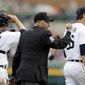 Home plate umpire Dan Iassogna signals the out call on Chicago White Sox&#39;s Marcus Semien on at attempted steal of second base because of batter interference, during the ninth inning of a baseball game in Detroit, Thursday, April 24, 2014. The Tigers won 7-4.  (AP Photo/Carlos Osorio)