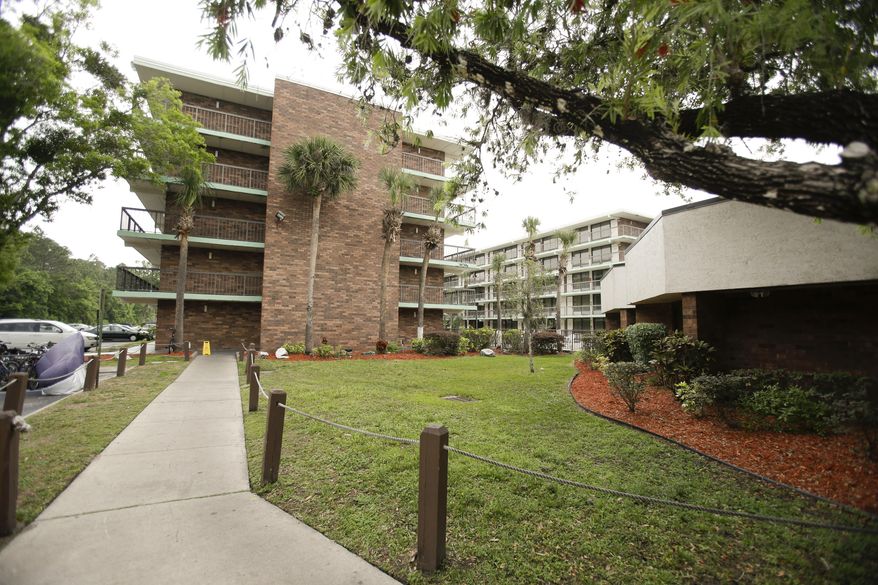 In this Tuesday, April 8, 2014 photo, the Home Suite Home extended stay hotel is shown in Kissimmee, Fla.  Owner Dianna Chane said she is sympathetic to the homeless families at her 403-room hotel, but she is unable to take new bookings since she can’t get current inhabitants to leave and she is unable to find a buyer for the property.(AP Photo/John Raoux)