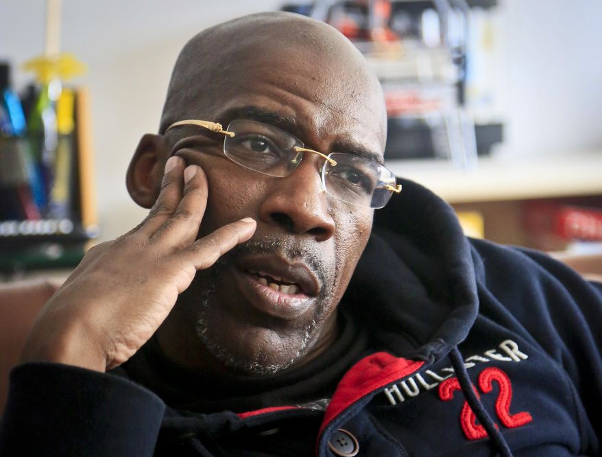 Jonathan Fleming, who was exonerated of murder after almost 25 years behind bars, listens during a visit with his lawyer on Friday April 18, 2014 in New York. The weeks since his release have been a mix of emotional highs and practical frustrations. “Coming back, you know, it’s been hard. ... It’s a lot to have to catch up on." (AP Photo/Bebeto Matthews)