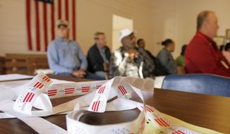 Voters gather in a nearly century-old school house, now a community center, being used as a polling place near Arkadelphia, Ark., Tuesday, Nov. 4, 2008. (AP Photo/Danny Johnston)
