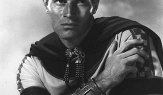 FILE - This 1958 file image released by Metro-Goldwyn-Mayer shows actor Charlton Heston in the 1958 film &amp;quot;Ben-Hur.&amp;quot; Mark Burnett and Roma Downey will produce a new version of the historical epic “Ben-Hur,” as the faith-based film revival continues on the big screen. Paramount Pictures and MGM announced Friday, April 25, 2014, that they will co-produce “Ben-Hur” with Burnett and Downey, who also made the recent miniseries “The Bible.” The film is set for release February 2016. (AP Photo/Metro-Goldwyn-Mayer, File)