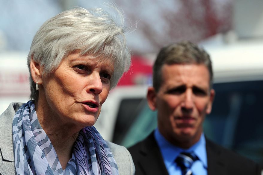 Milford Police Chief Keith Mello, right, listens as Schools Superintendent Elizabeth Feser speals during a news conference at Jonathan Law High School in Milford, Conn., Friday, April 25, 2014. Authorities have confirmed that Maren Sanchez, 16, was stabbed to death Friday. A teenage boy is in custody, and police are investigating whether the attack stemmed from her turning down an invitation to be his prom date. (AP Photo/The Connecticut Post, Ned Gerard) MANDATORY CREDIT