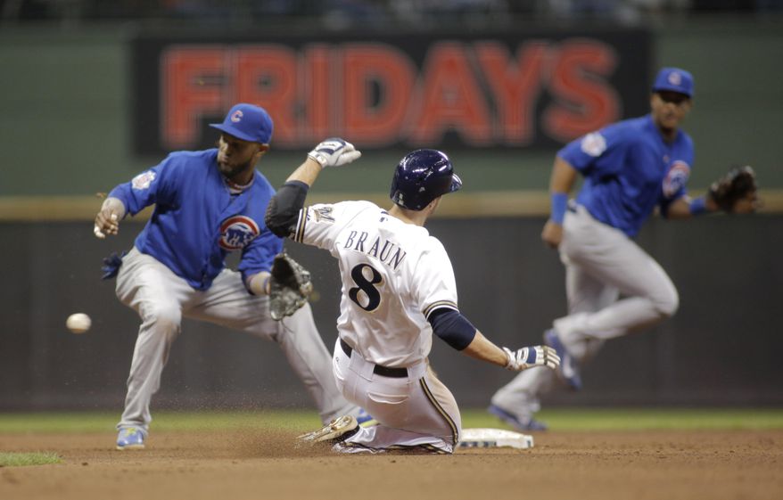 Milwaukee Brewers right fielder Ryan Braun, center, steals second base as Chicago Cubs shortstop Starlin Castro, left, waits for the throw during the fifth inning of a baseball game Friday, April 25, 2014, in Milwaukee. (AP Photo/Darren Hauck)