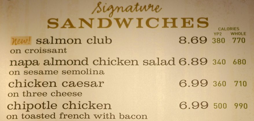 FILE - This march 8, 2010 file photo shows the sandwich board at a Panera store with the calorie count for each item, in Brookline, Mass. Diners could soon see calorie counts on menus of chain restaurants. But what about the roasted chicken sold at grocery stores, or the hot dogs convenience stores sell? Will movie theaters have to tell patrons the number of calories in a giant soda and bucket of popcorn? The food industry is closely watching the Food and Drug Administration to see which establishments are included in the final menu labeling rules, expected this year.  (AP Photo/Charles Krupa, File)