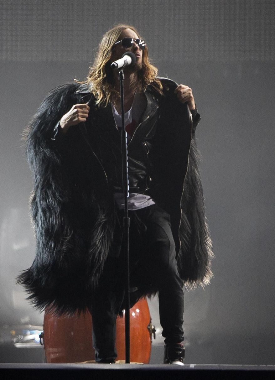 FILE - In this Sept. 14, 2013 file photo, Jared Leto of Thirty Seconds To Mars performs at the annual Rock in Rio music festival in Rio de Janeiro, Brazil. Leto is promoting “Artifact,” a documentary he directed about his band 30 Seconds to Mars’ battle with its record label over its contract and a $30 million lawsuit. The film, available now on iTunes, airs April 26, 2014, on VH1 and Palladia. (AP Photo/Silvia Izquierdo, file)