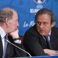French President of the Euro 2016 organizing committee Jacques Lambert, left, speaks with UEFA president Michel Platini during a press conference for the presentation of the 2016 European Football Championship in Paris, Friday April 25, 2014. The Euro 2016 championship will run from June 10 to July 10, 2016. (AP Photo/Jacques Brinon)