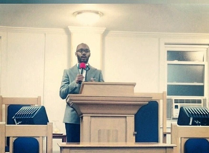 The author addressing the youth of the Redeemed House of Prayer on obtaining success. (Photo Credit: Ivin Myles II.)
