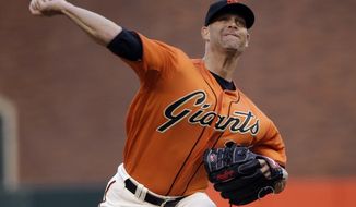 San Francisco Giants starting pitcher Tim Hudson throws to the Cleveland Indians during the first inning of a baseball game Friday, April 25, 2014, in San Francisco. (AP Photo/Marcio Jose Sanchez)
