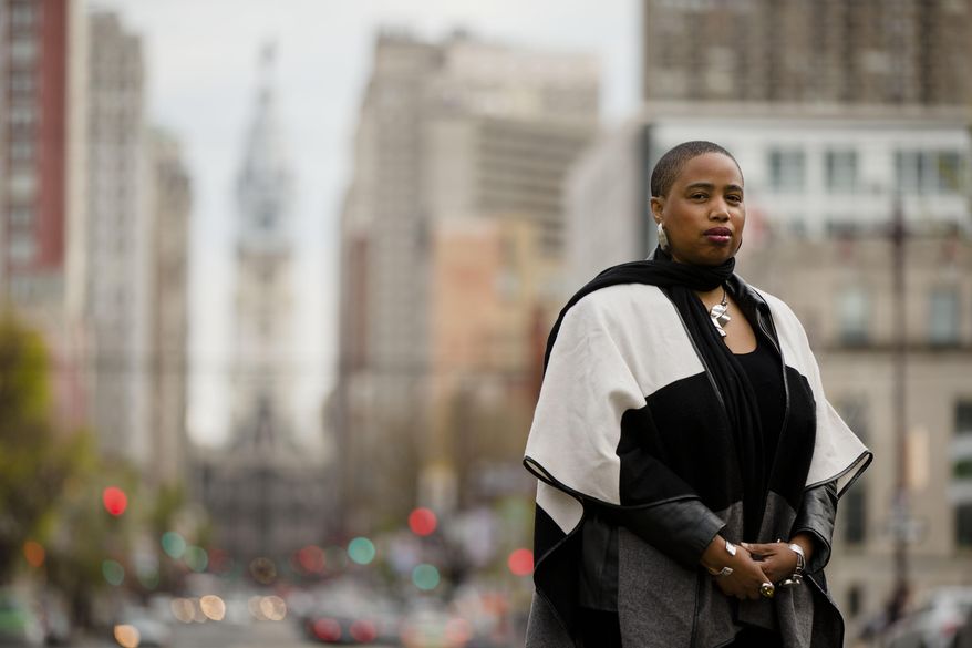 Filmmaker and writer Aishah Shahidah Simmons, who teaches in the women’s and LGBT studies program at Temple University, poses for a photograph Friday, April 25, 2014, in Philadelphia. Students on college campuses across the country are increasingly asking their professors to provide "trigger warnings" for classes that cover content that might be upsetting to individuals who have been sexually assaulted, touched by suicide, survived war or experienced other traumatic situations. Such warnings, long a feature of the blogosphere, are now cropping up on course syllabi or before lectures. Simmons is a rape and incest survivor who is “on the fence” about making trigger warnings mandatory for college faculty, but already uses them in her courses. (AP Photo/Matt Rourke)