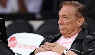 FILE - In this Oct. 17, 2010 file photo, Los Angeles Clippers team owner Donald Sterling watches his team play in Los Angeles. The NBA is investigating a report of an audio recording in which a man purported to be Sterling makes racist remarks while speaking to his girlfriend.  NBA spokesman Mike Bass said in a statement Saturday, APril 26, 2014, that the league is in the process of authenticating the validity of the recording posted on TMZ&#x27;s website. Bass called the comments &quot;disturbing and offensive.&quot;  (AP Photo/Mark J. Terrill, File)