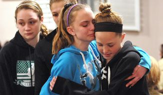 (Peter Casolino-New Haven Register)  Friends and family including many students from Jonathan Law High School attend a memorial service at the First United Church of Christ in Milford, Conn., for Maren Sanchez who was killed at the school Friday April 25, 2014. The 16-year-old girl was stabbed to death inside a Connecticut high school Friday, and police were investigating whether a boy attacked her after she turned down an invitation to be his prom date. (AP Photo/The New Haven Register, Peter Casolino)
