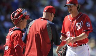 Washington Nationals relief pitcher Ross Detwiler, right, is pulled from the game by manager Matt Williams, left, during the sixth inning of a baseball game against the San Diego Padres, Sunday, April 27, 2014, in Washington. The Padres won 4-2. (AP Photo/Nick Wass)