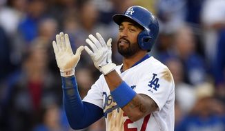 Los Angeles Dodgers&#39; Matt Kemp celebrates after hitting a solo home run during the third inning of a baseball game against the Colorado Rockies, Saturday, April 26, 2014, in Los Angeles. (AP Photo/Mark J. Terrill)