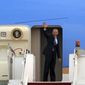 President Barack Obama waves as he boards Air Force One at the Royal Malaysian Air Force base in Subang, Malaysia, Monday, April 28, 2014, before heading to Ninoy Aquino International Airport in Pasay, Philippines. (AP Photo/Lai Seng Sin)